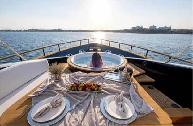 a person sitting in a boat aboard HARUN Yacht for Charter