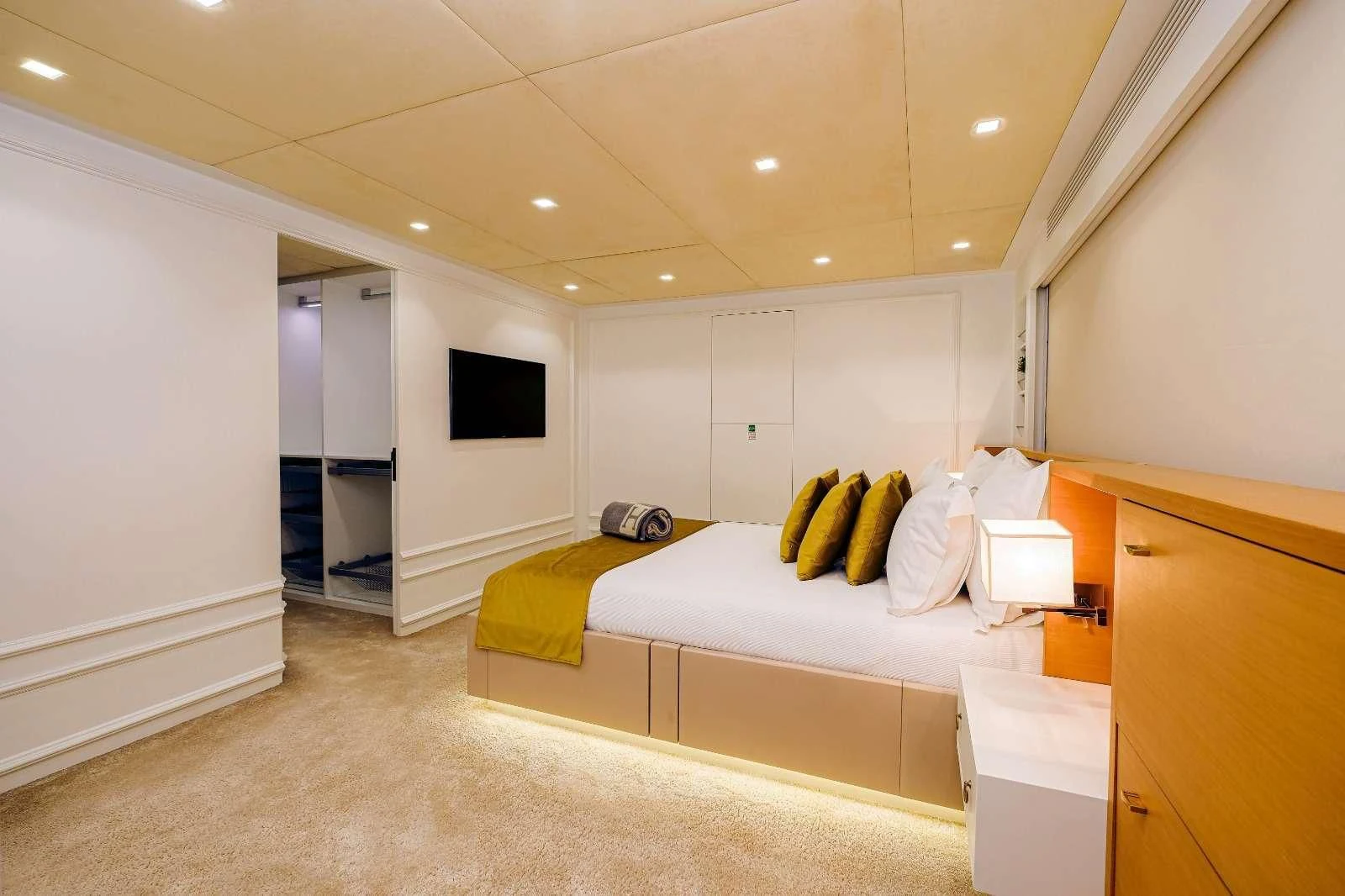 a room with a bed and a tv aboard HARUN Yacht for Charter