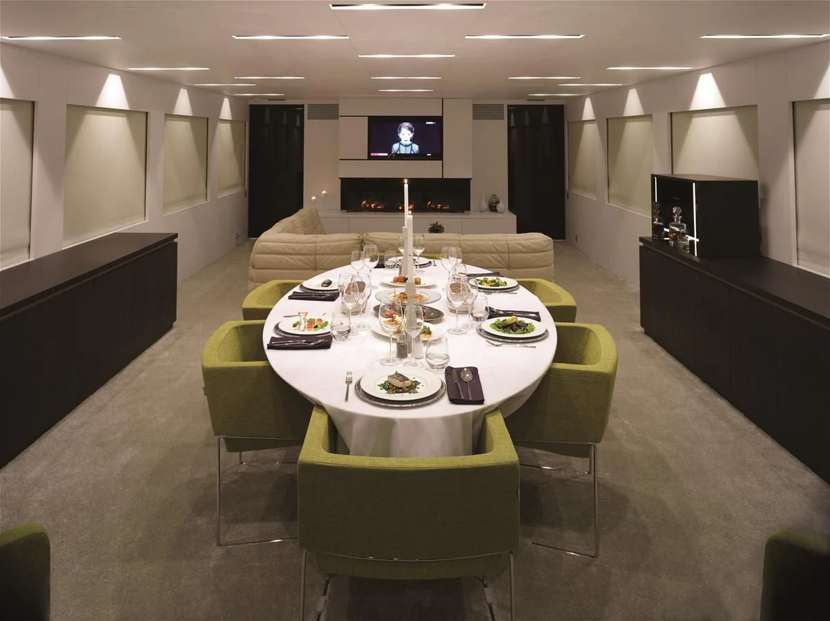 a table with a plate and chairs aboard HARUN Yacht for Charter
