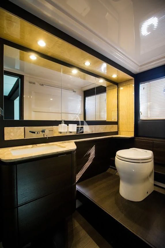 a bathroom with a large mirror aboard TAMARA II Yacht for Sale