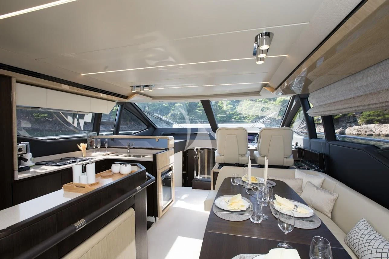 a dining table in a train car aboard TAMARA II Yacht for Sale