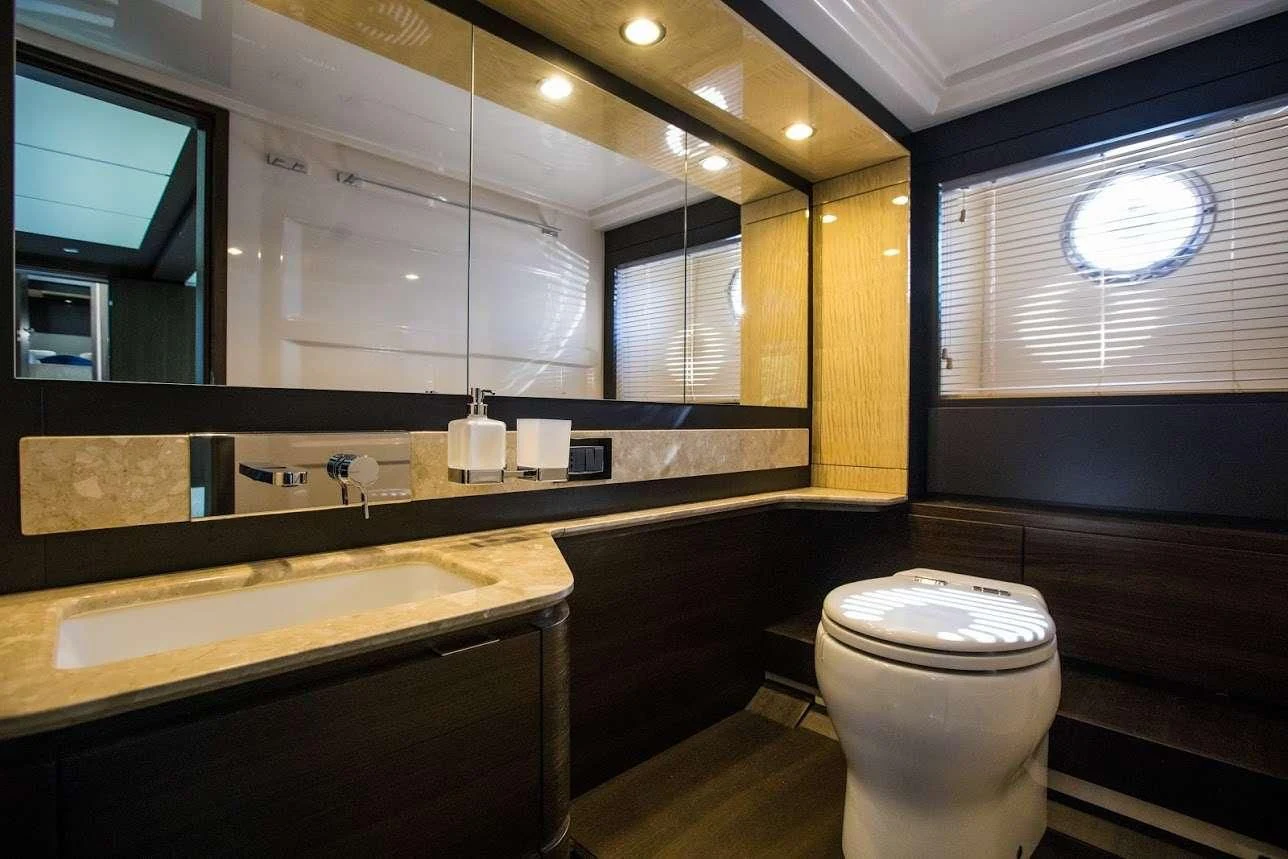 a bathroom with a large mirror aboard TAMARA II Yacht for Sale