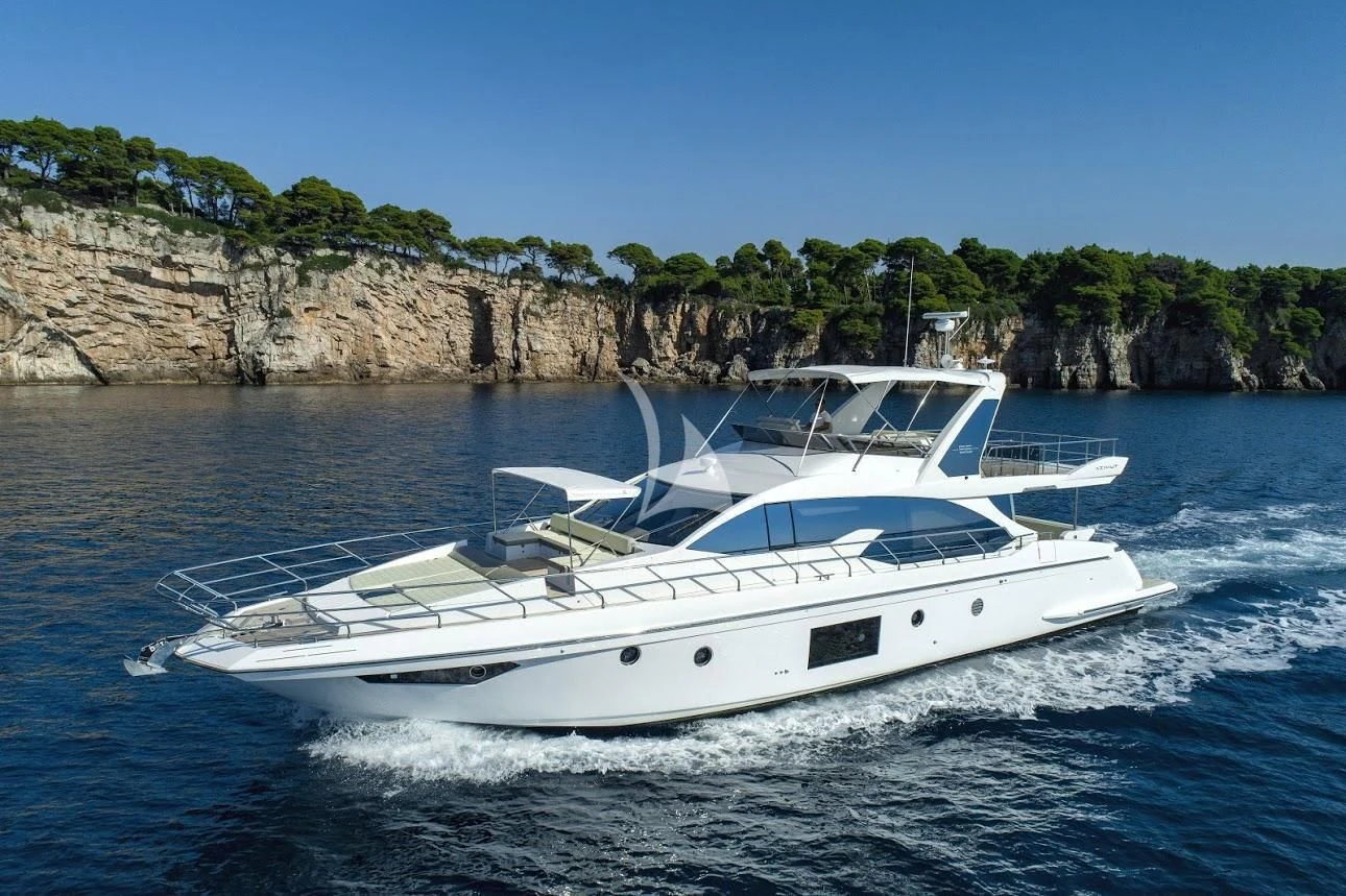 a white boat on water aboard TAMARA II Yacht for Sale