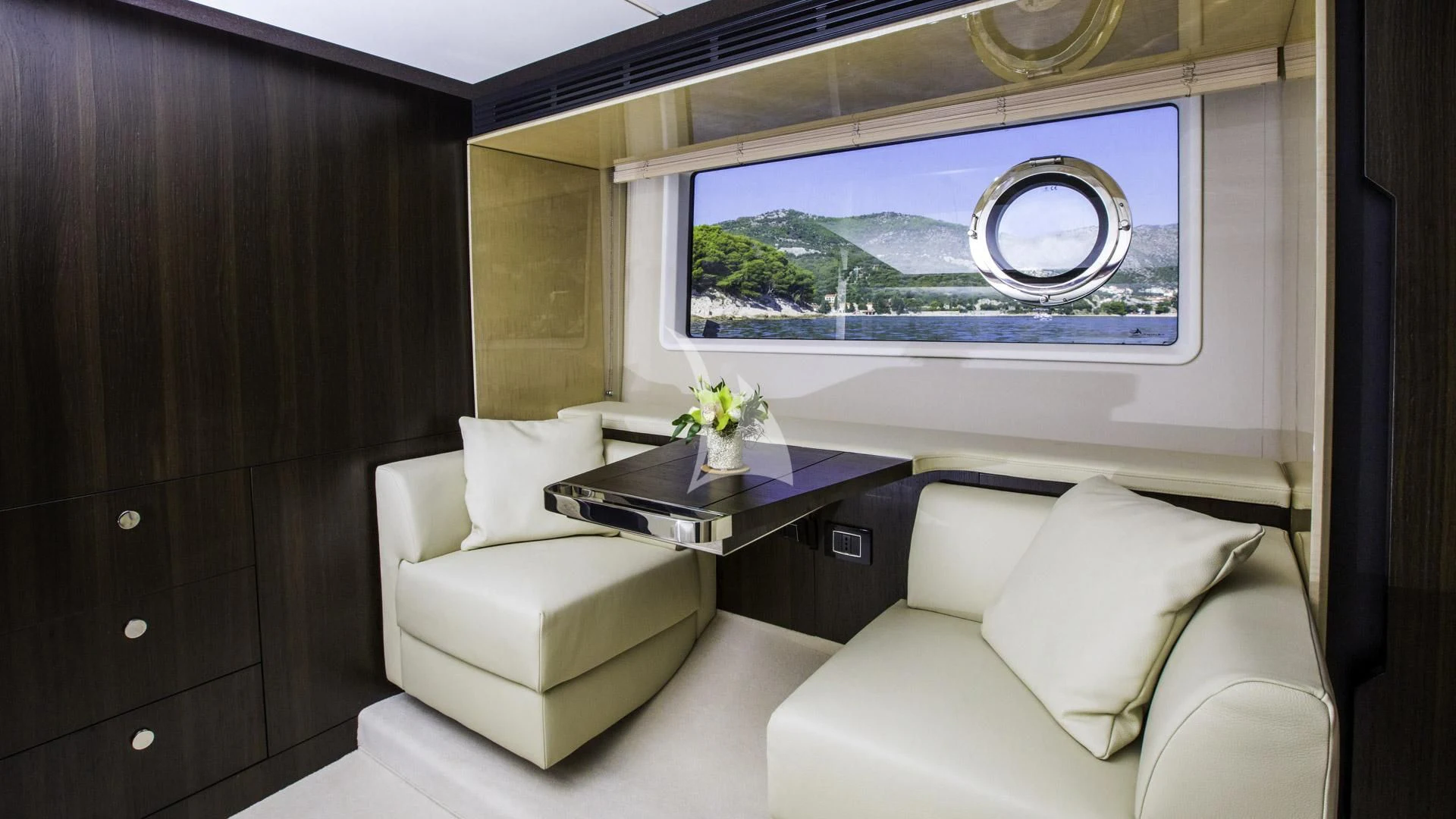 a room with a table and chairs aboard TAMARA II Yacht for Sale