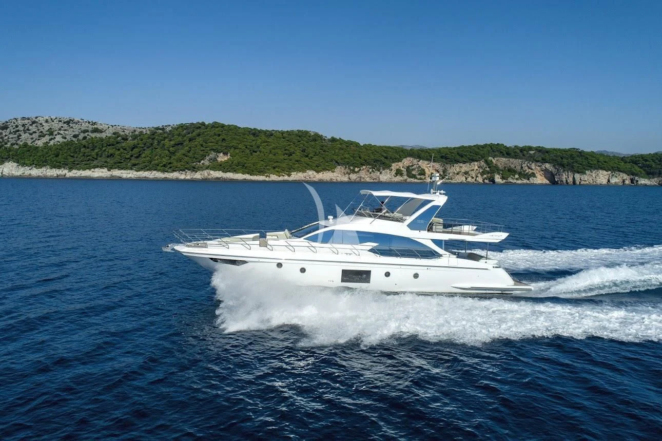 a white boat on the water aboard TAMARA II Yacht for Sale