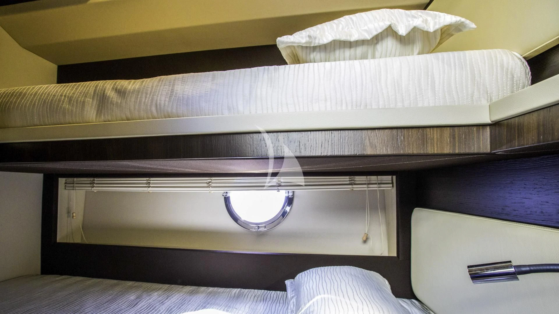 a bed with a white bed sheet aboard TAMARA II Yacht for Sale