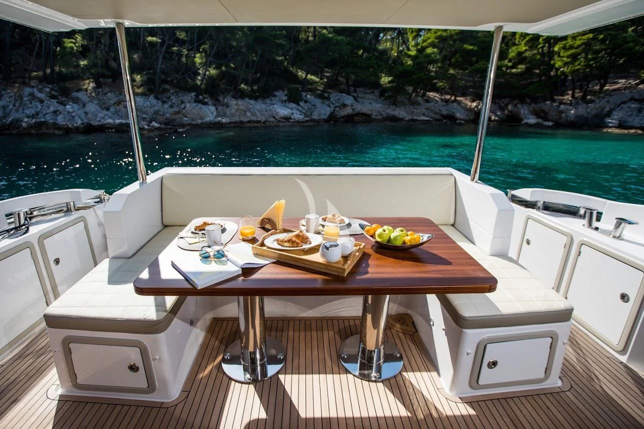 a table with food on it aboard TAMARA II Yacht for Sale