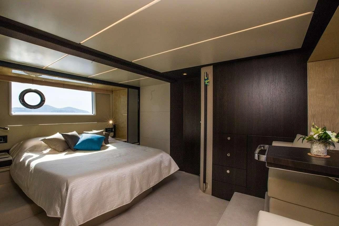 a bedroom with a large bed aboard TAMARA II Yacht for Sale