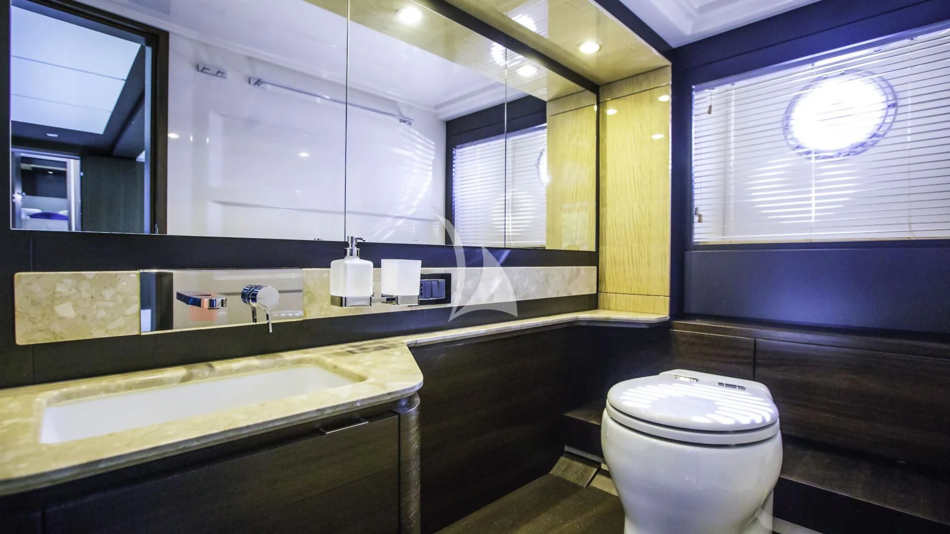 a bathroom with a large mirror aboard TAMARA II Yacht for Sale