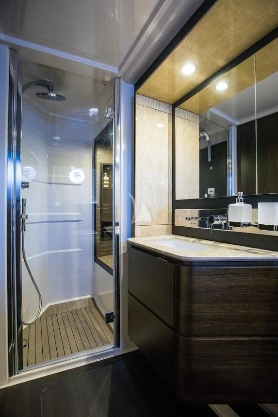 a bathroom with a glass shower aboard TAMARA II Yacht for Sale