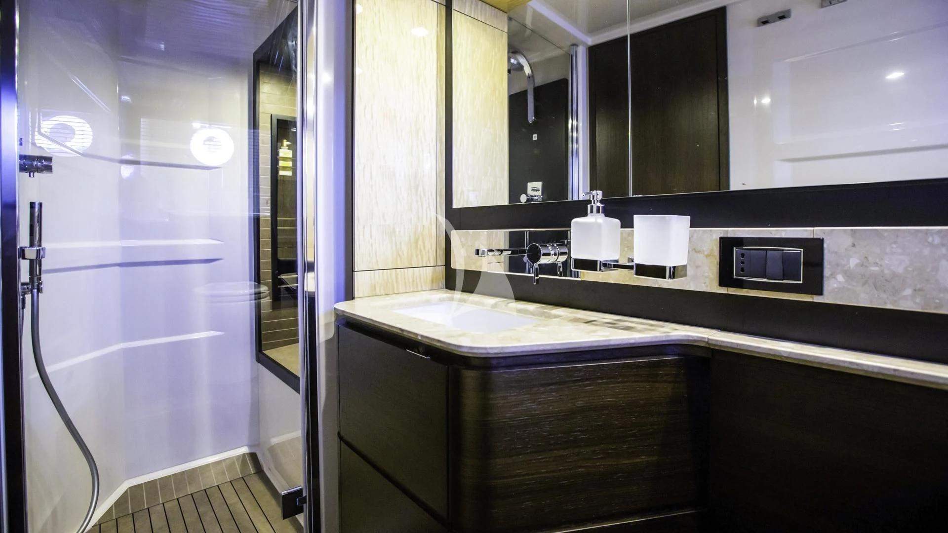 a bathroom with a sink and a mirror aboard TAMARA II Yacht for Sale