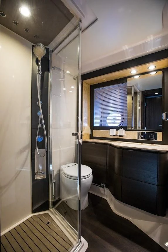 a bathroom with a shower unit and a toilet aboard TAMARA II Yacht for Sale