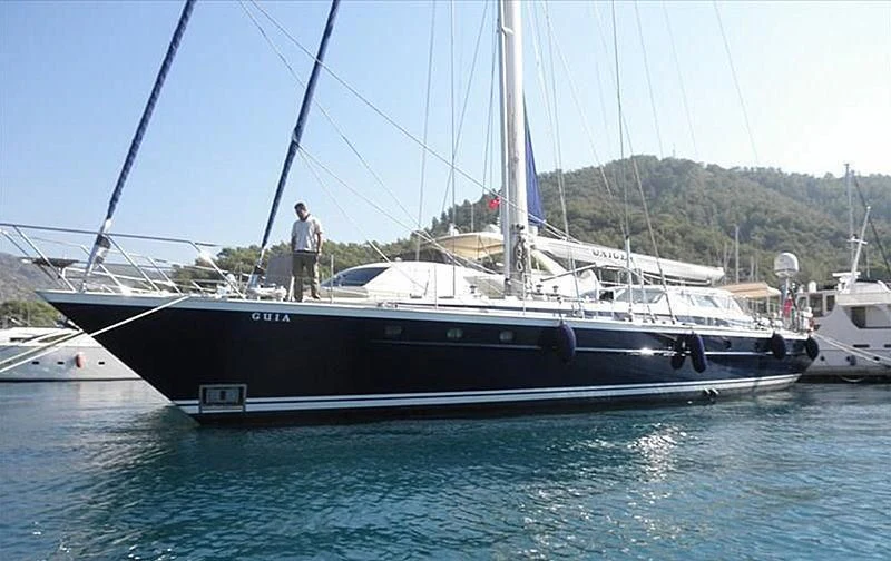 a person standing on a boat aboard GUIA Yacht for Sale
