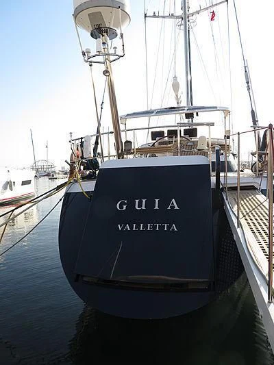 a black and white boat aboard GUIA Yacht for Sale