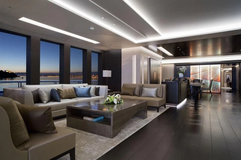 a living room with a large window aboard MOGAMBO Yacht for Sale