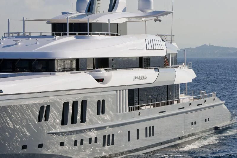 a large white boat in the water aboard MOGAMBO Yacht for Sale