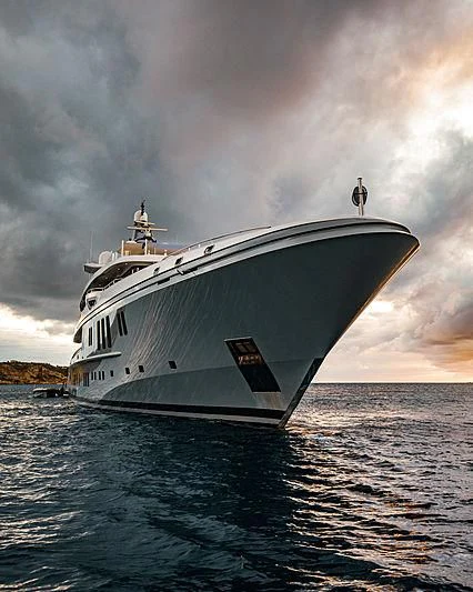 a large white boat on the water aboard MOGAMBO Yacht for Sale