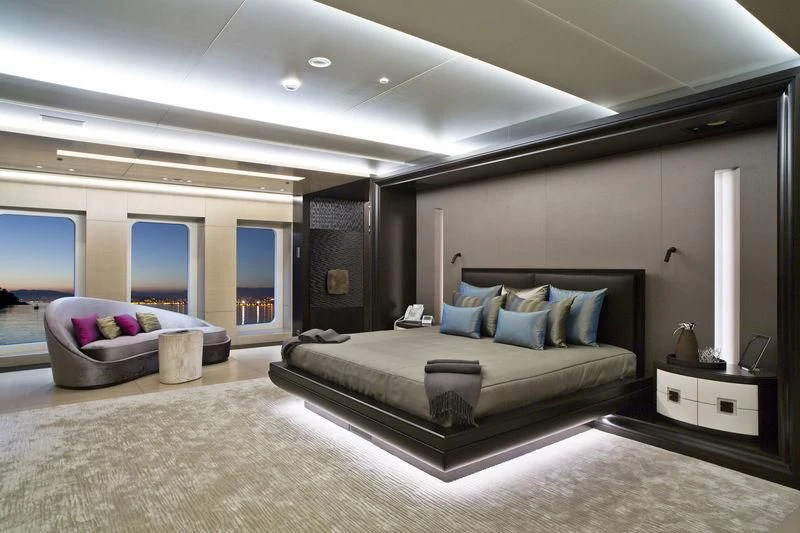 a large modern bedroom aboard MOGAMBO Yacht for Sale