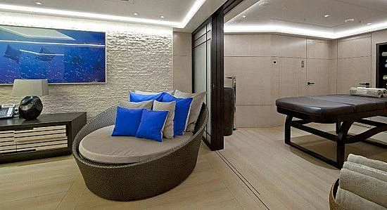 a large room with a couch and a table aboard MOGAMBO Yacht for Sale