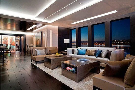 a living room with a large window aboard MOGAMBO Yacht for Sale