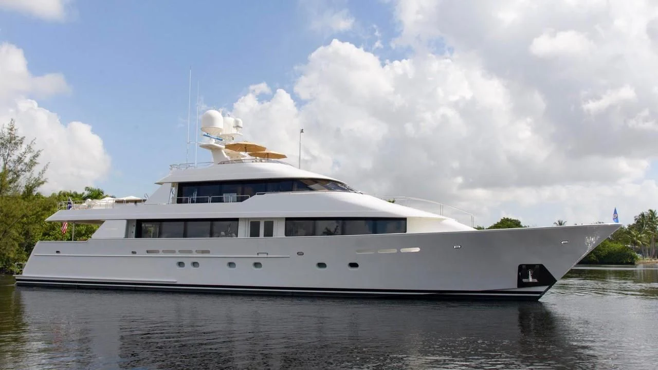 a large white boat on the water aboard GODSPEED Yacht for Sale