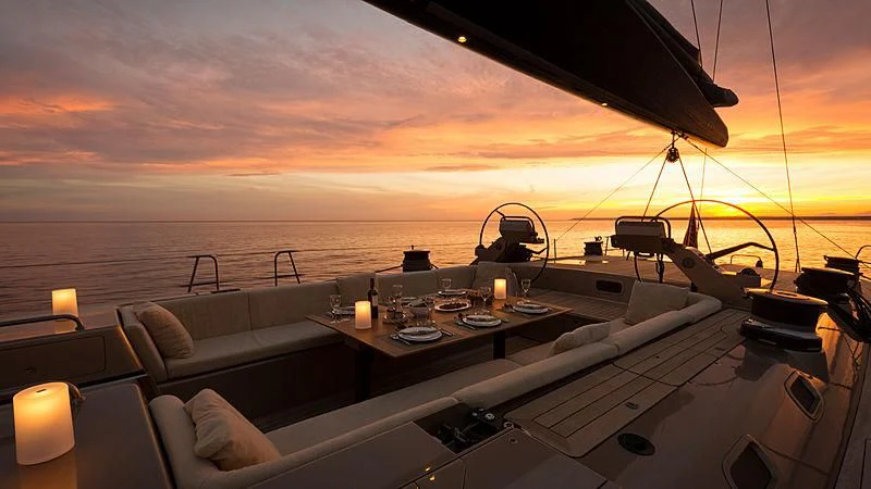 a ship with a table and chairs aboard WALLY LOVE Yacht for Charter