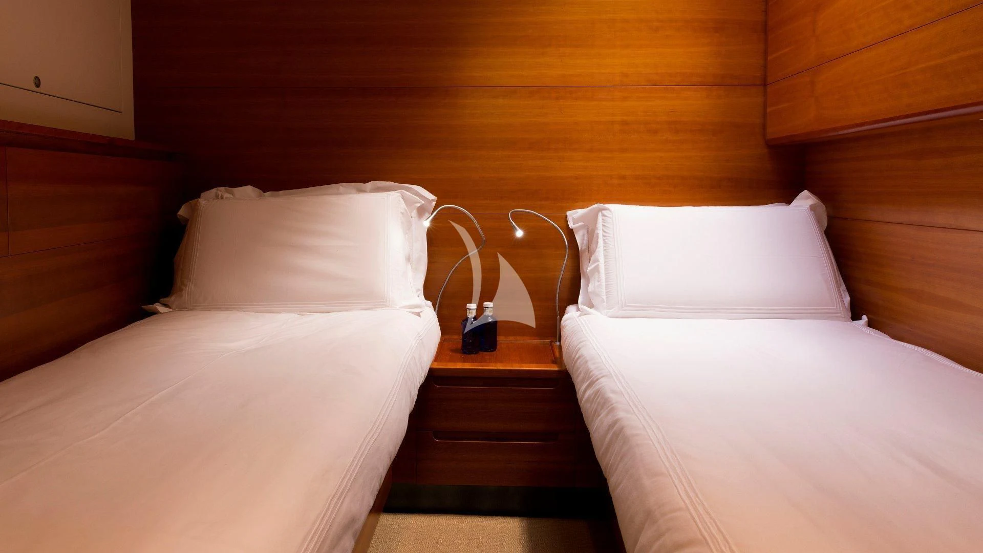 a couple of beds in a room aboard WALLY LOVE Yacht for Charter