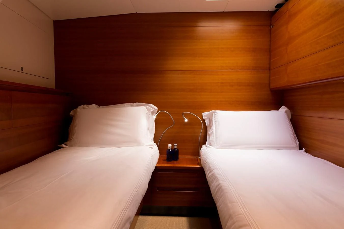 a bed with white sheets aboard WALLY LOVE Yacht for Charter