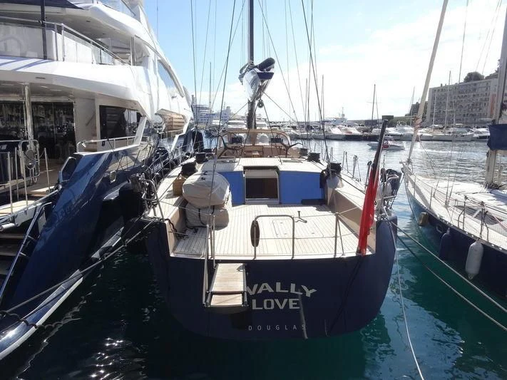 a boat docked in a harbor aboard WALLY LOVE Yacht for Charter