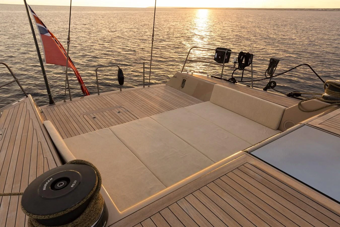 a boat with a flag on the front aboard WALLY LOVE Yacht for Charter