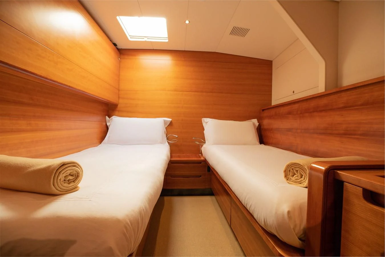 a room with a couple beds aboard WALLY LOVE Yacht for Charter