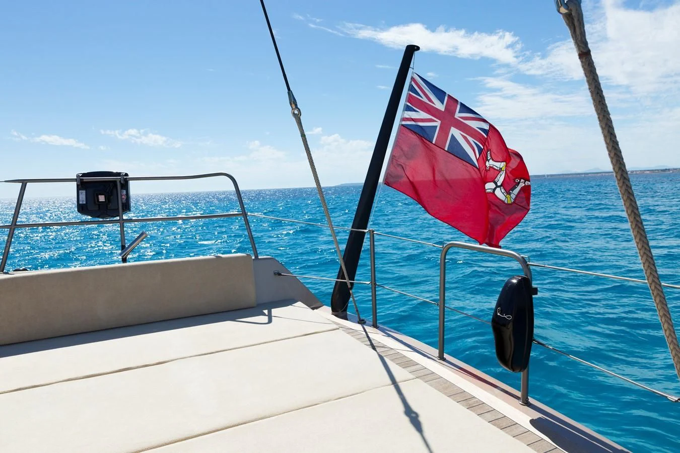 a boat with a flag on the front aboard WALLY LOVE Yacht for Charter