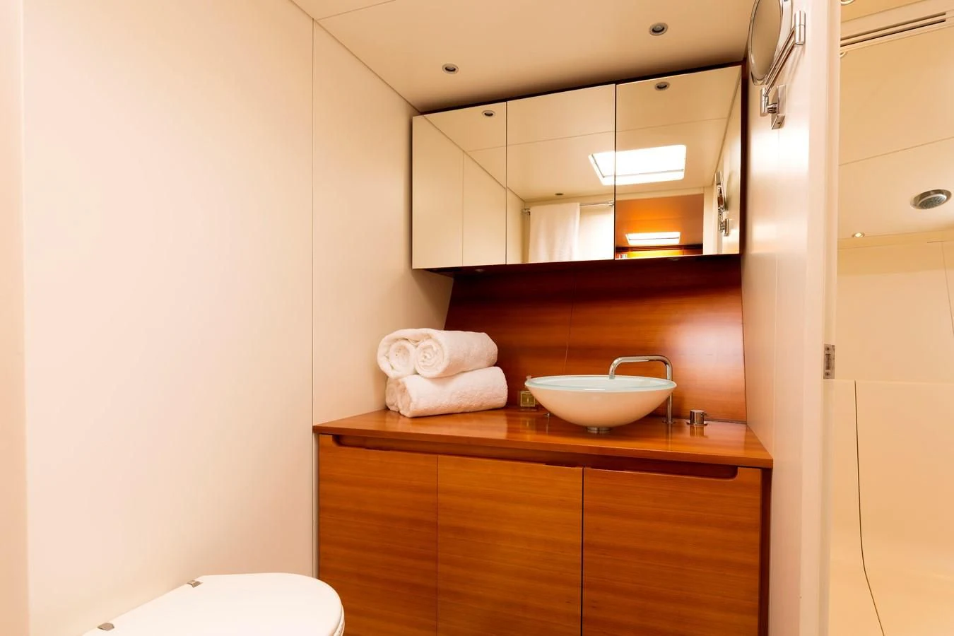 a bathroom with a sink and mirror aboard WALLY LOVE Yacht for Charter
