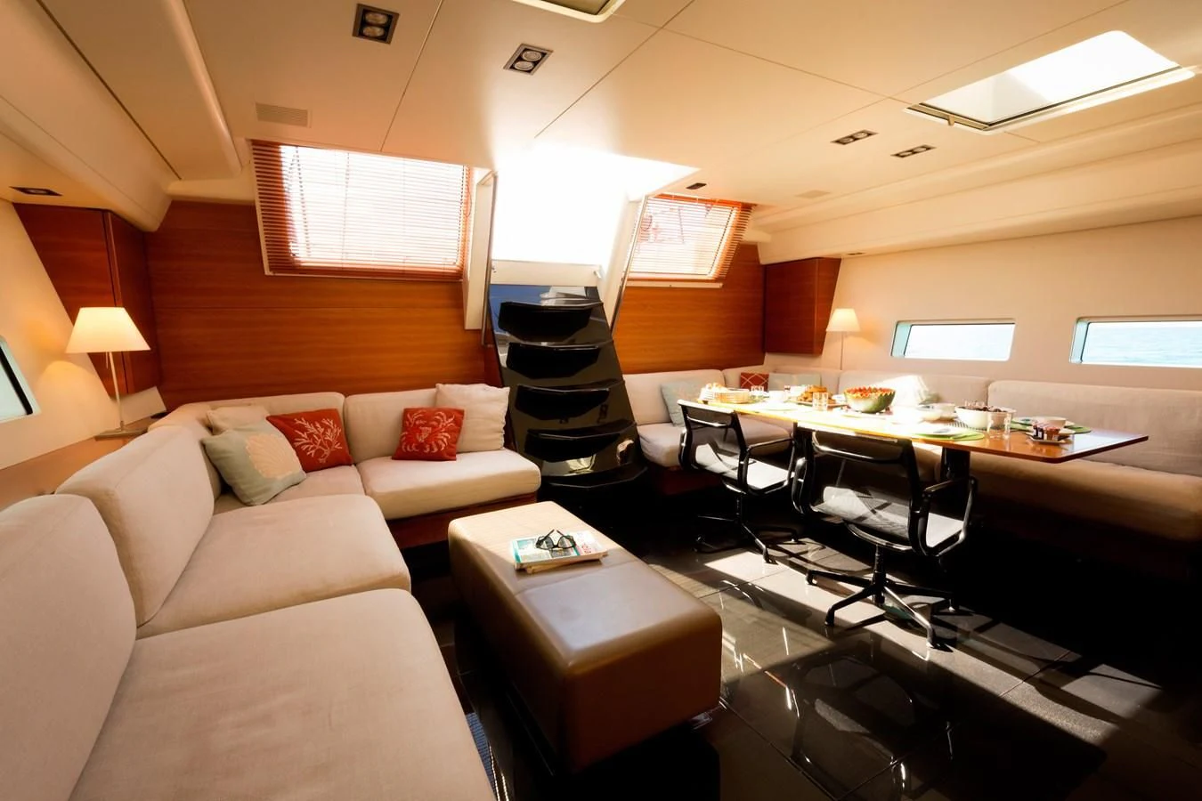 a living room with a couch and a television aboard WALLY LOVE Yacht for Charter