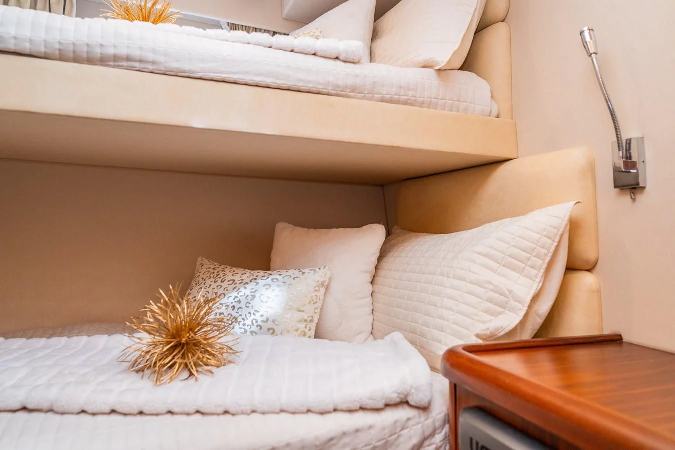 a bed with pillows aboard SUNSEEKER 70' MANHATTAN Yacht for Sale
