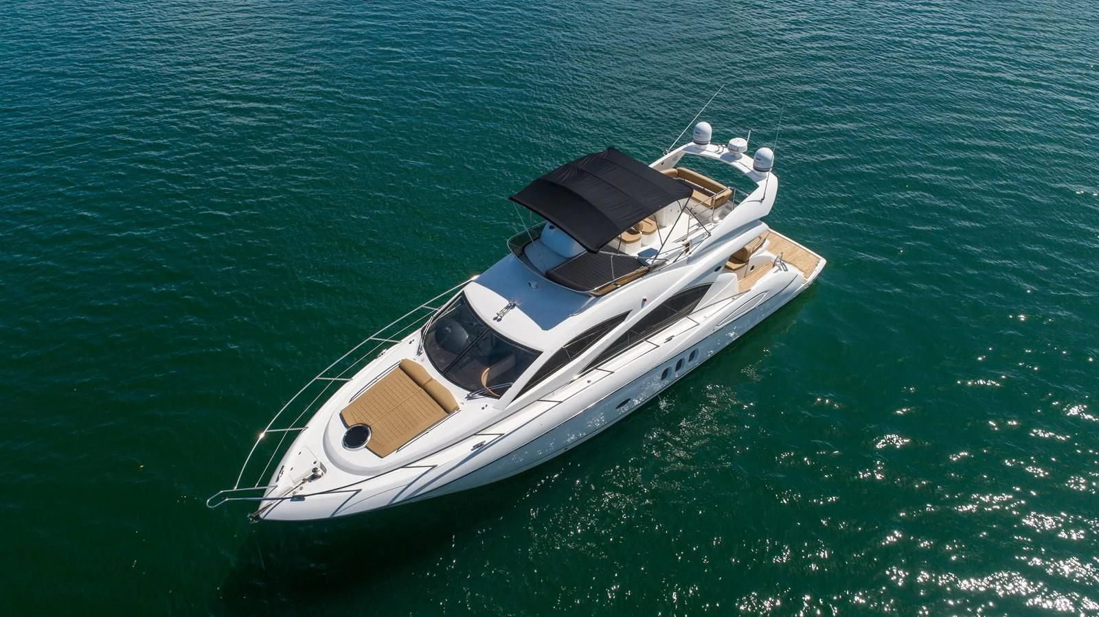 a boat in the water aboard SUNSEEKER 70' MANHATTAN Yacht for Sale