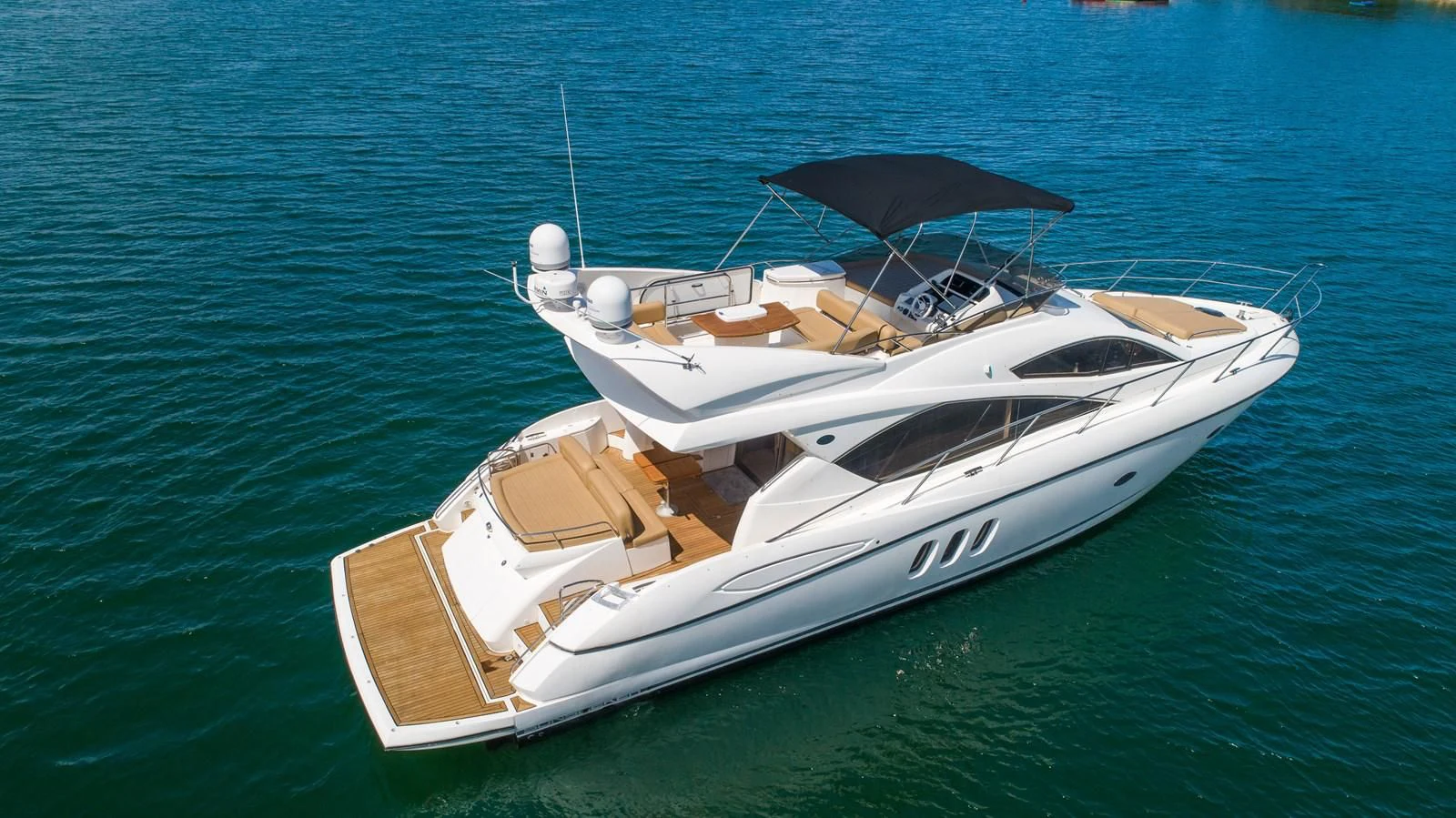 a boat on the water aboard SUNSEEKER 70' MANHATTAN Yacht for Sale