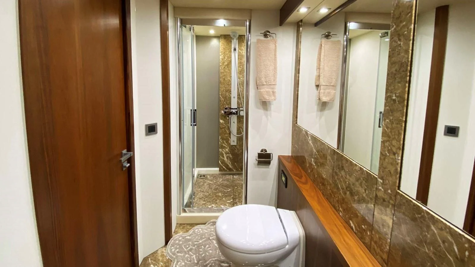 a bathroom with a glass shower aboard SUNSEEKER 70' MANHATTAN Yacht for Sale