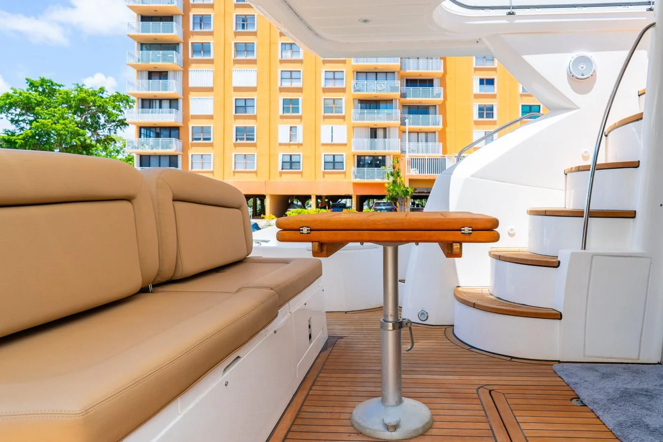 a living room with a table and a couch aboard SUNSEEKER 70' MANHATTAN Yacht for Sale