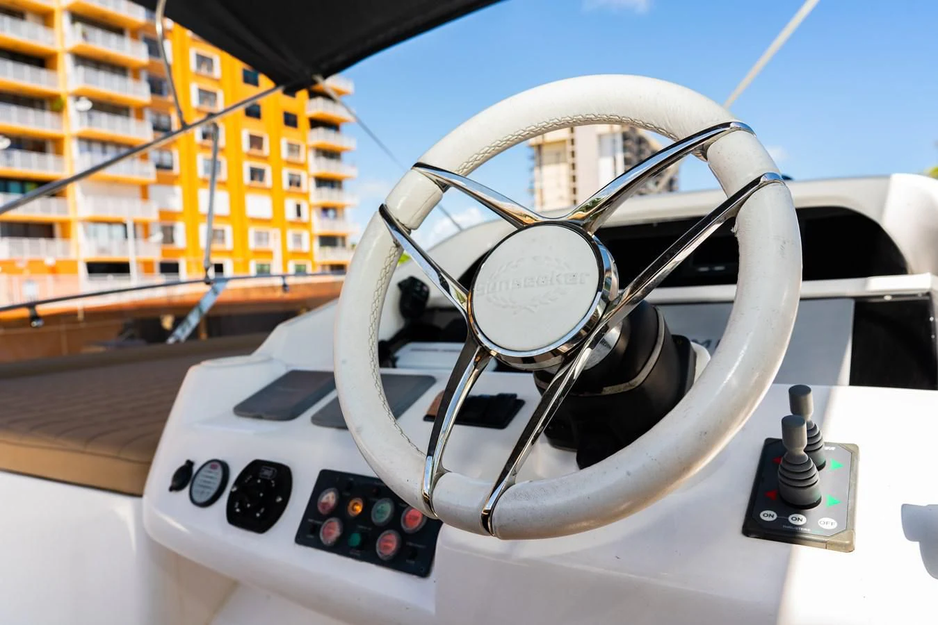a steering wheel and a building aboard SUNSEEKER 70' MANHATTAN Yacht for Sale