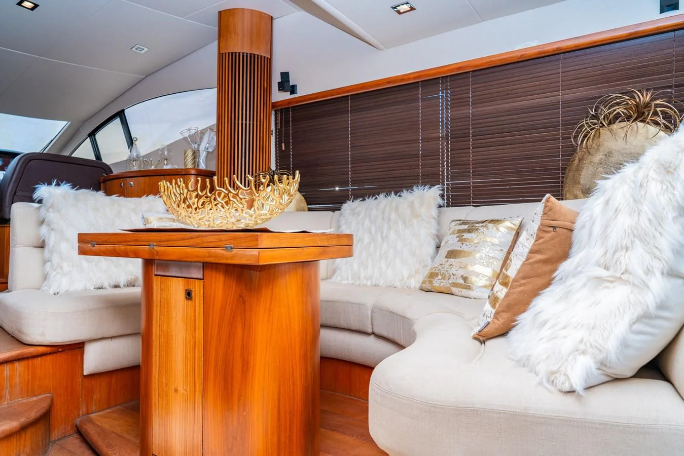 a living room with a fireplace aboard SUNSEEKER 70' MANHATTAN Yacht for Sale