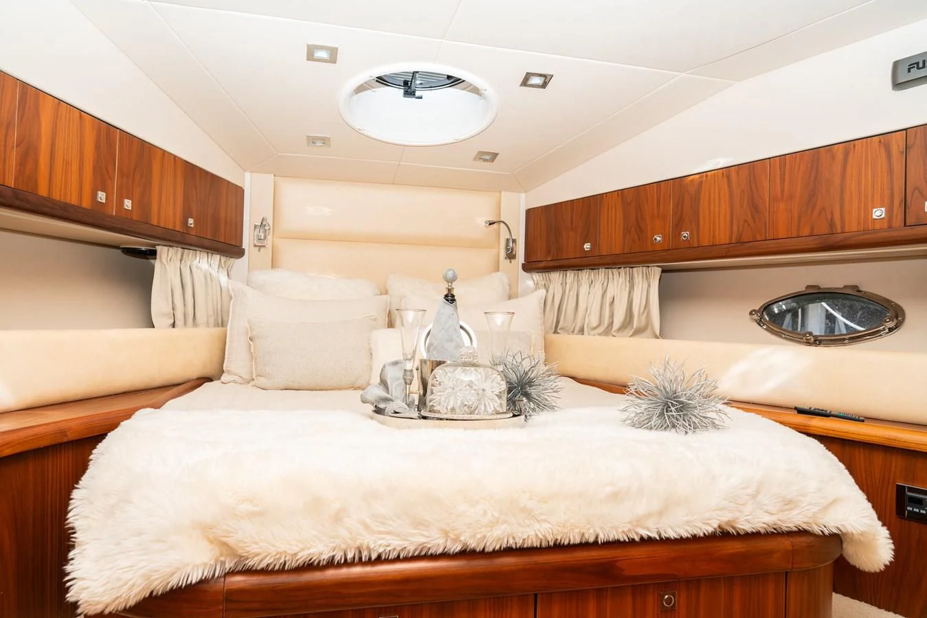 a large white bed in a room aboard SUNSEEKER 70' MANHATTAN Yacht for Sale