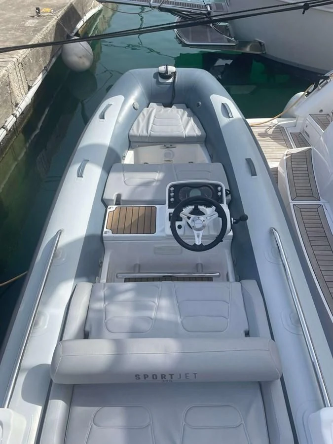 a large grey military vehicle aboard SUNSEEKER 70' MANHATTAN Yacht for Sale