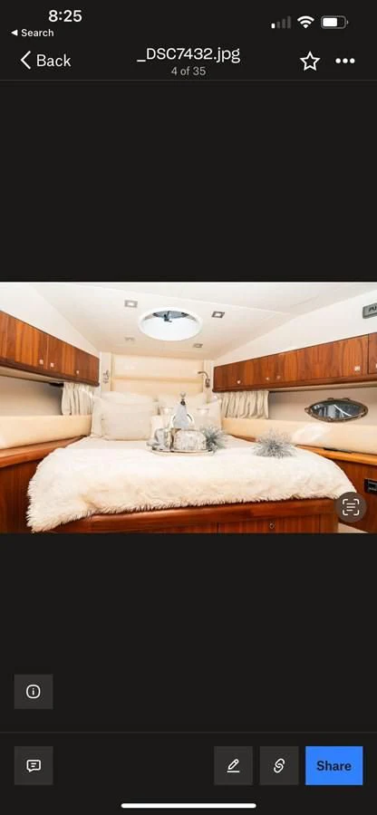 a screenshot of a bedroom aboard SUNSEEKER 70' MANHATTAN Yacht for Sale