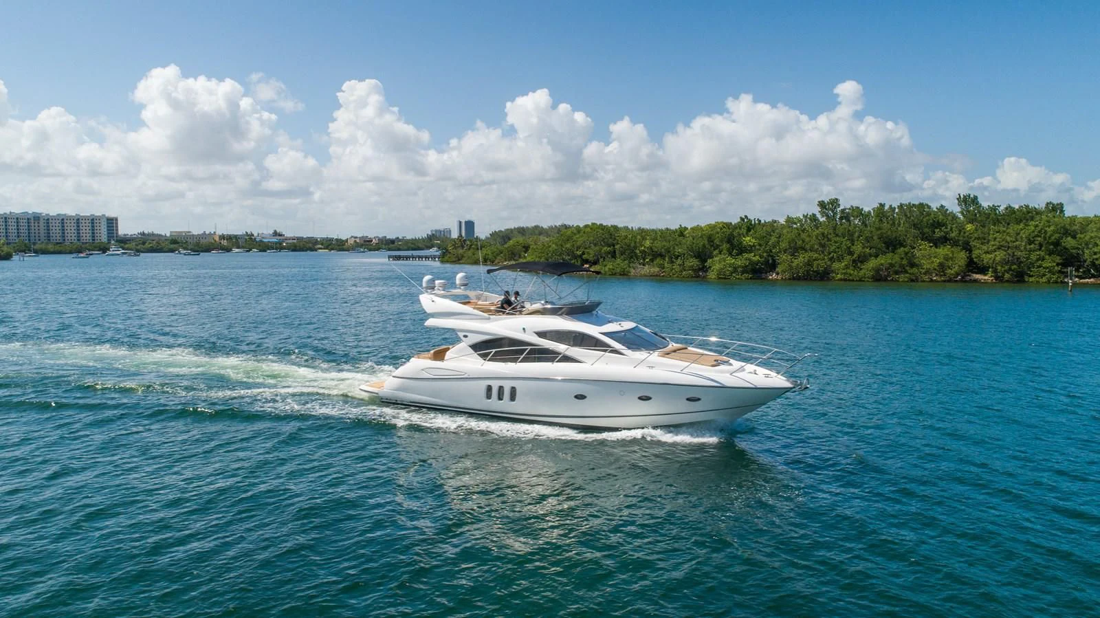 a boat on the water aboard SUNSEEKER 70' MANHATTAN Yacht for Sale