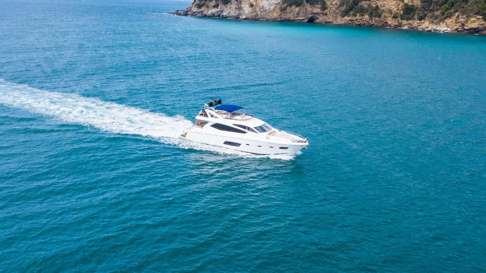 a white boat in the water aboard SUNSEEKER 70' MANHATTAN Yacht for Sale