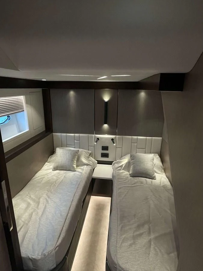 a room with two beds aboard SUNSEEKER 70' MANHATTAN Yacht for Sale