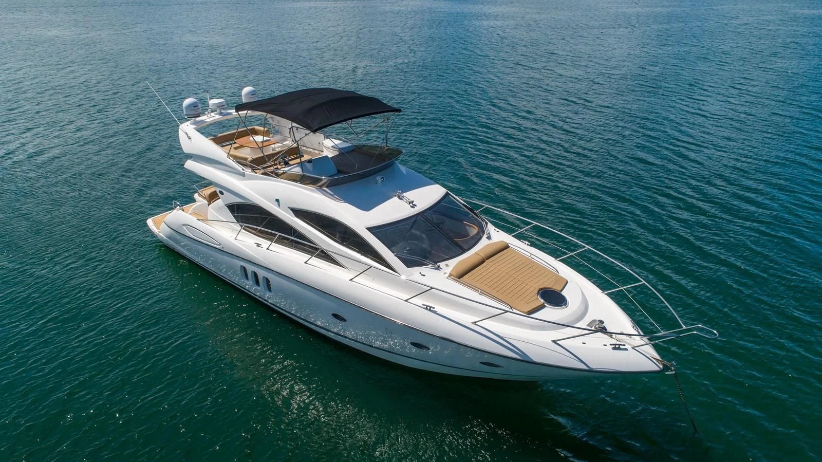 a boat in the water aboard SUNSEEKER 70' MANHATTAN Yacht for Sale