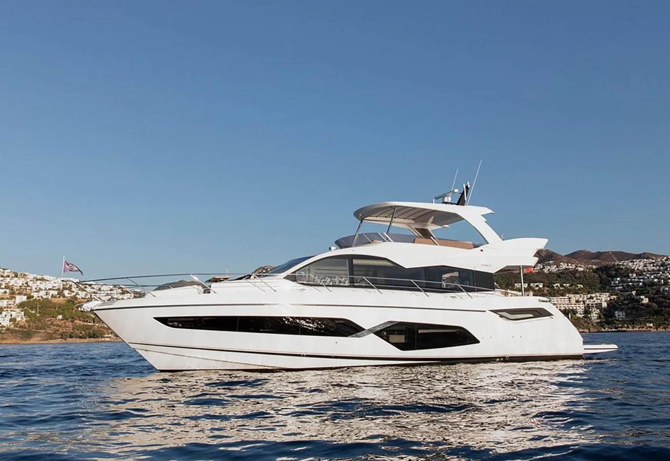 a white yacht on the water aboard SUNSEEKER 70' MANHATTAN Yacht for Sale