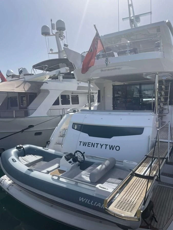 a boat with a flag on the front aboard SUNSEEKER 70' MANHATTAN Yacht for Sale